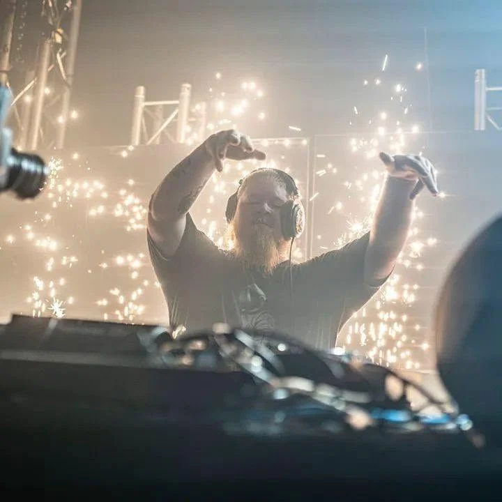 Subikon performing live behind a DJ console